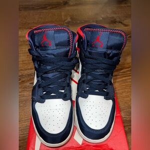 Jordan’s Navy & White High-Top Sneakers with Red Accents